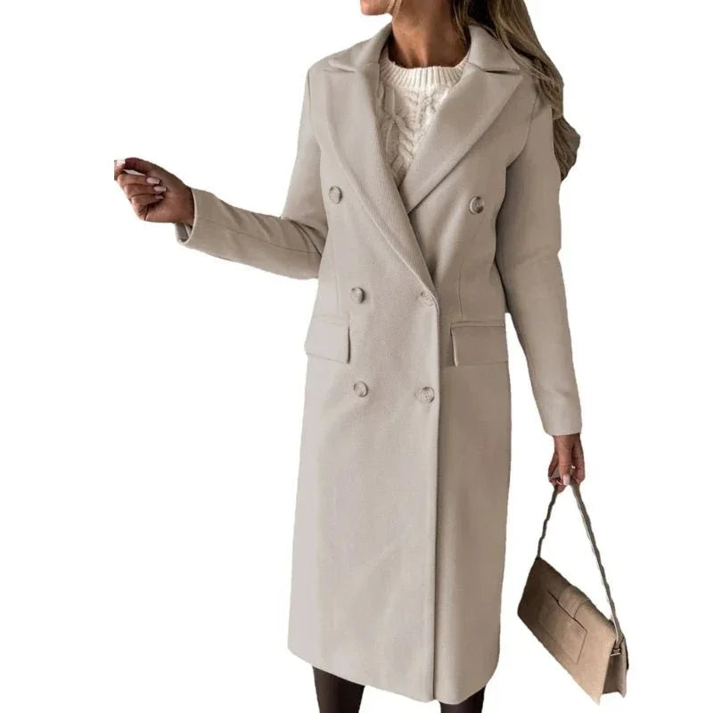 Woman wearing an elegant beige wool trench coat and holding a matching handbag