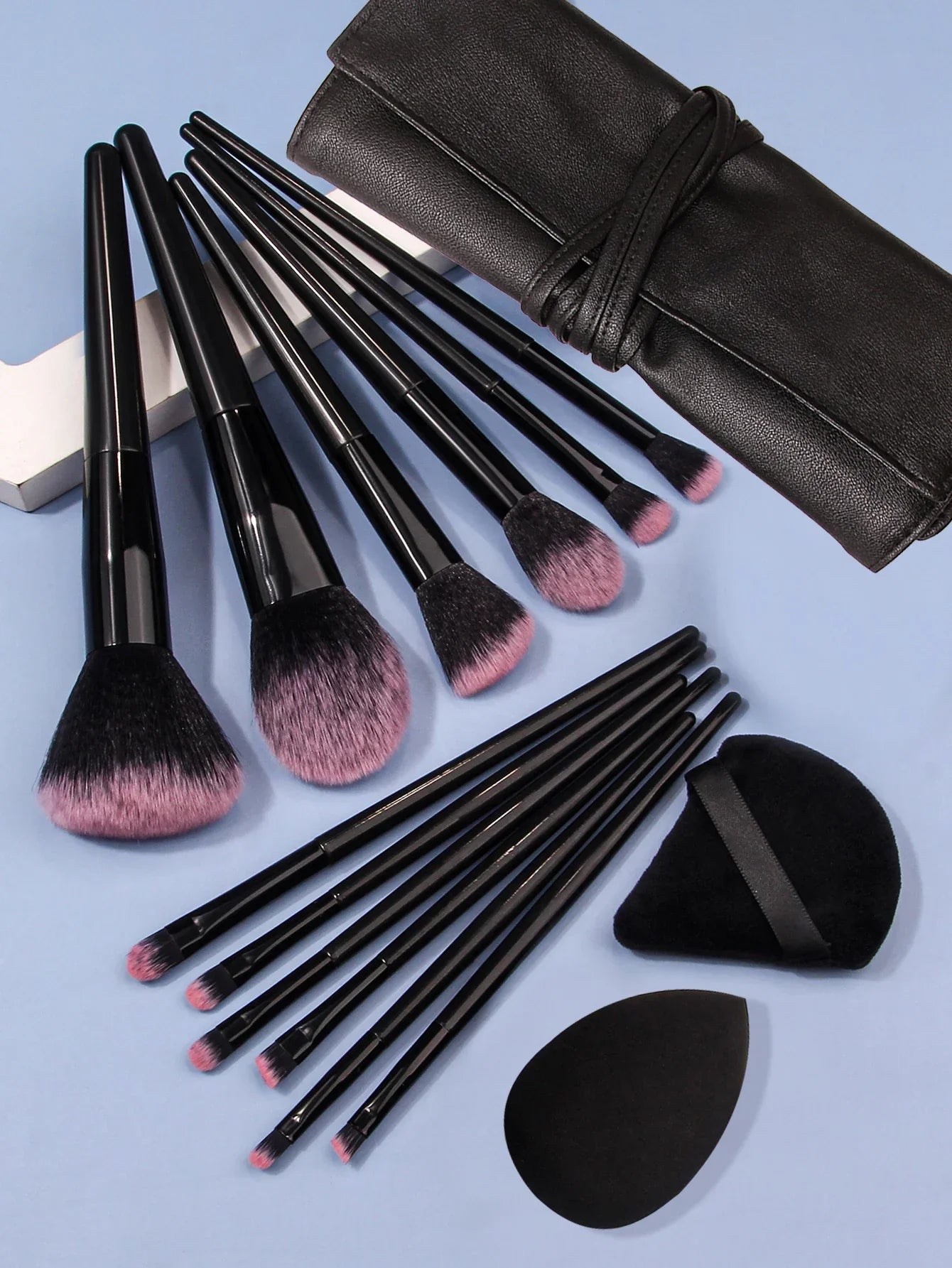 Luxury soft makeup brush set with 13 black handles and pink bristles, black pouch included