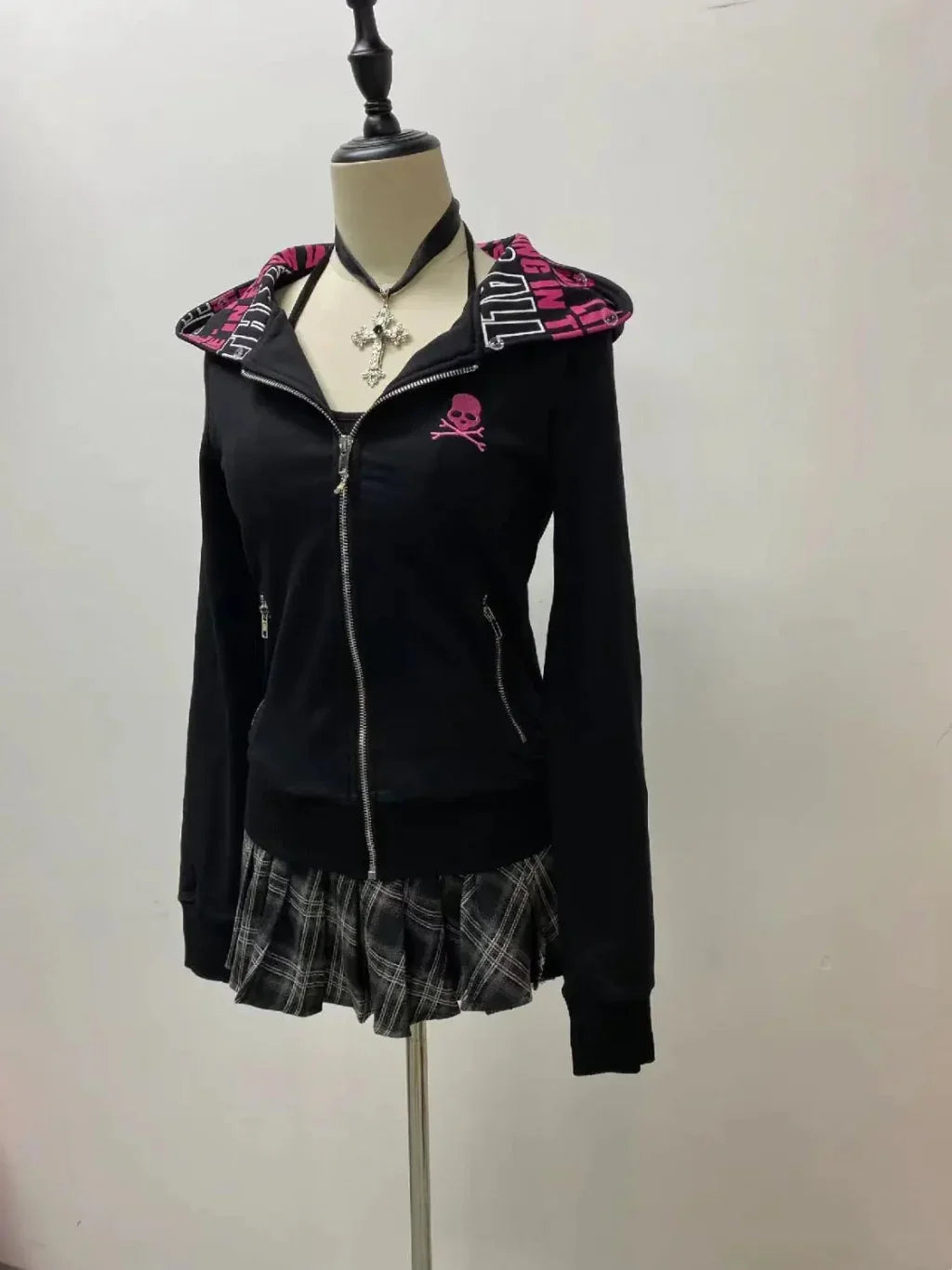 Y2K gothic skull hoodie for women with plaid skirt on mannequin, punk fashion