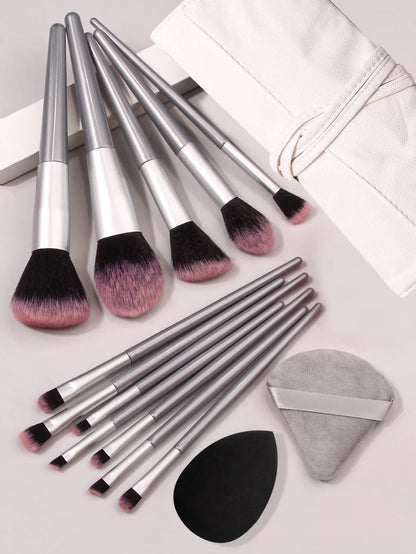 Luxury soft makeup brush set with silver handles, blending sponges, and white case