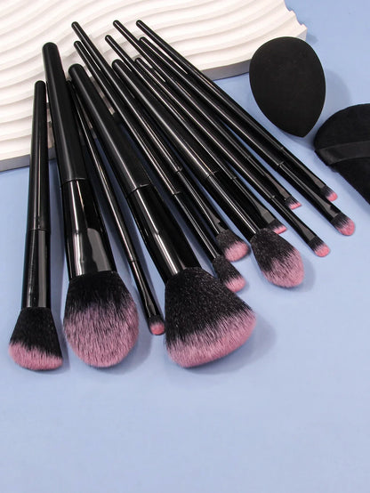 Luxury soft makeup brush set with black handles and pink bristles on a blue background