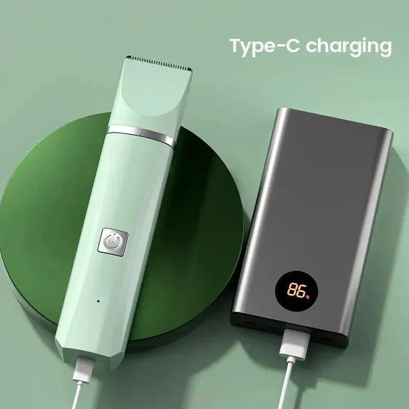 Cordless pet grooming clipper charging via Type-C with power bank on green background