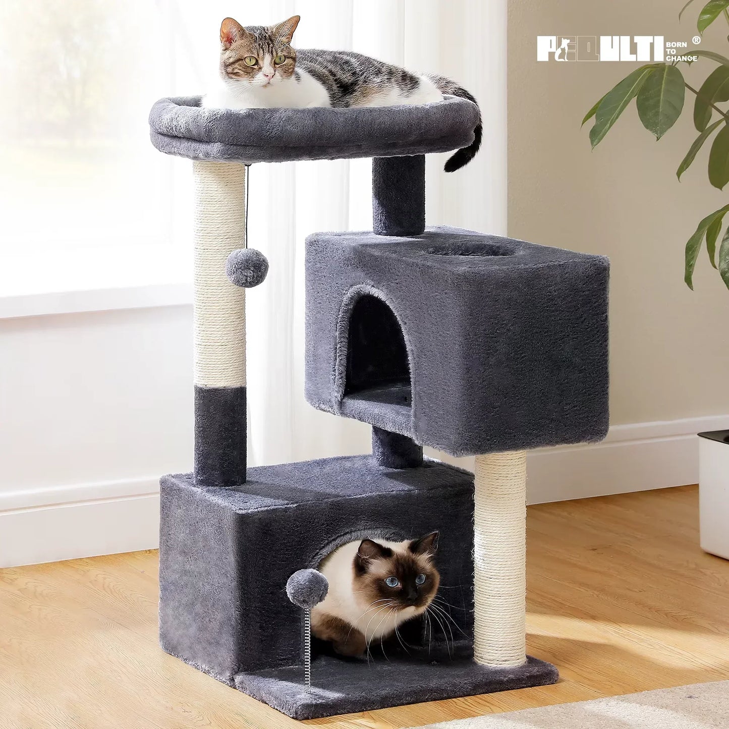 Two cats on a gray cat tree tower with scratching posts and plush condos indoors