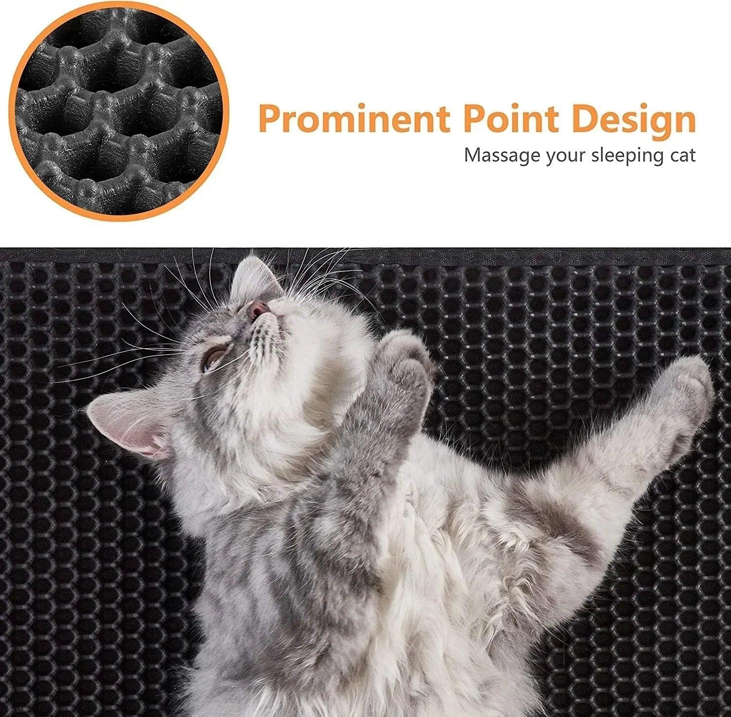 Gray cat lying on black litter mat with honeycomb texture and prominent point design