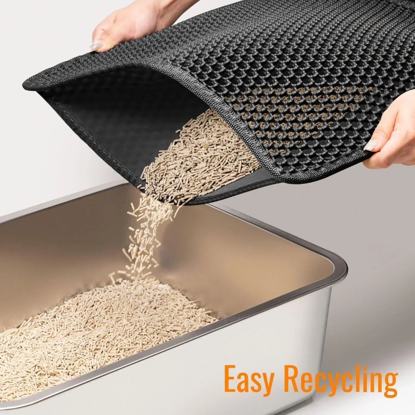 Black cat litter mat being emptied into a litter box, easy recycling feature highlighted