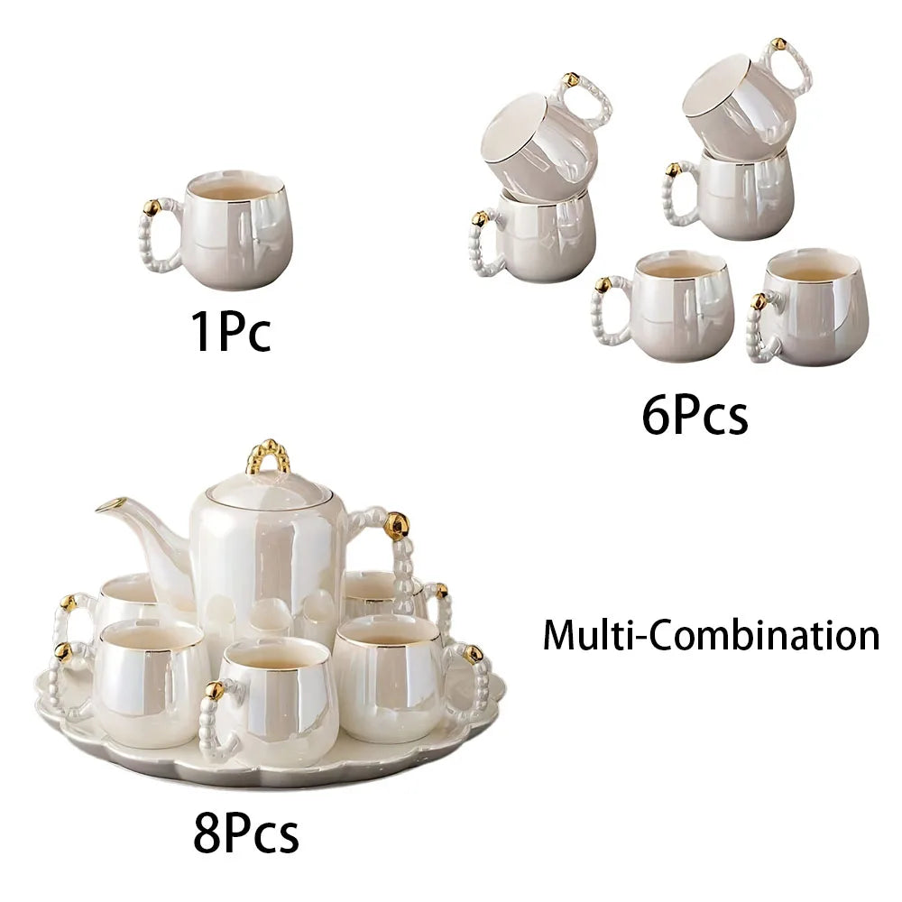 Elegant pearl glazed porcelain tea set with gold accents, including teapot, six cups, and tray