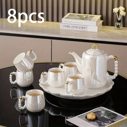 8-piece pearl glazed porcelain tea set with European style teapot and cups on black table