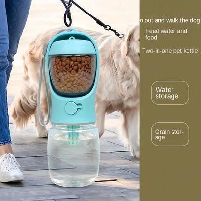 Portable two-in-one blue pet water bottle with attached food storage for dogs, held by owner on leash