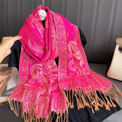 Pink paisley pashmina scarf with fringe, floral print, displayed on black shirt
