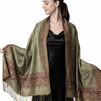 Woman wearing olive green paisley shawl with fringe, elegant evening wrap scarf