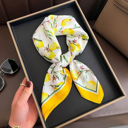 Silk lemon print scarf with yellow border in gift box, fashion accessory display