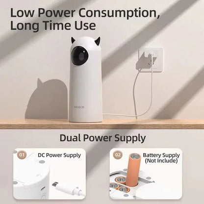 Smart automatic LED laser cat toy with dual power supply, plugged into wall, on tabletop.