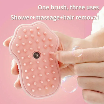 Pink steam grooming brush for cats and dogs with massage bristles in hand