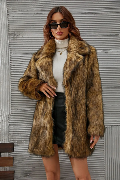 Woman wearing stylish brown faux fur coat, white turtleneck, black leather skirt, and black sunglasses in front of textured gray wall