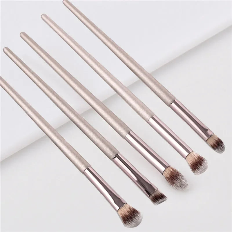 Champagne luxury makeup brush set with five eyeshadow brushes on white background