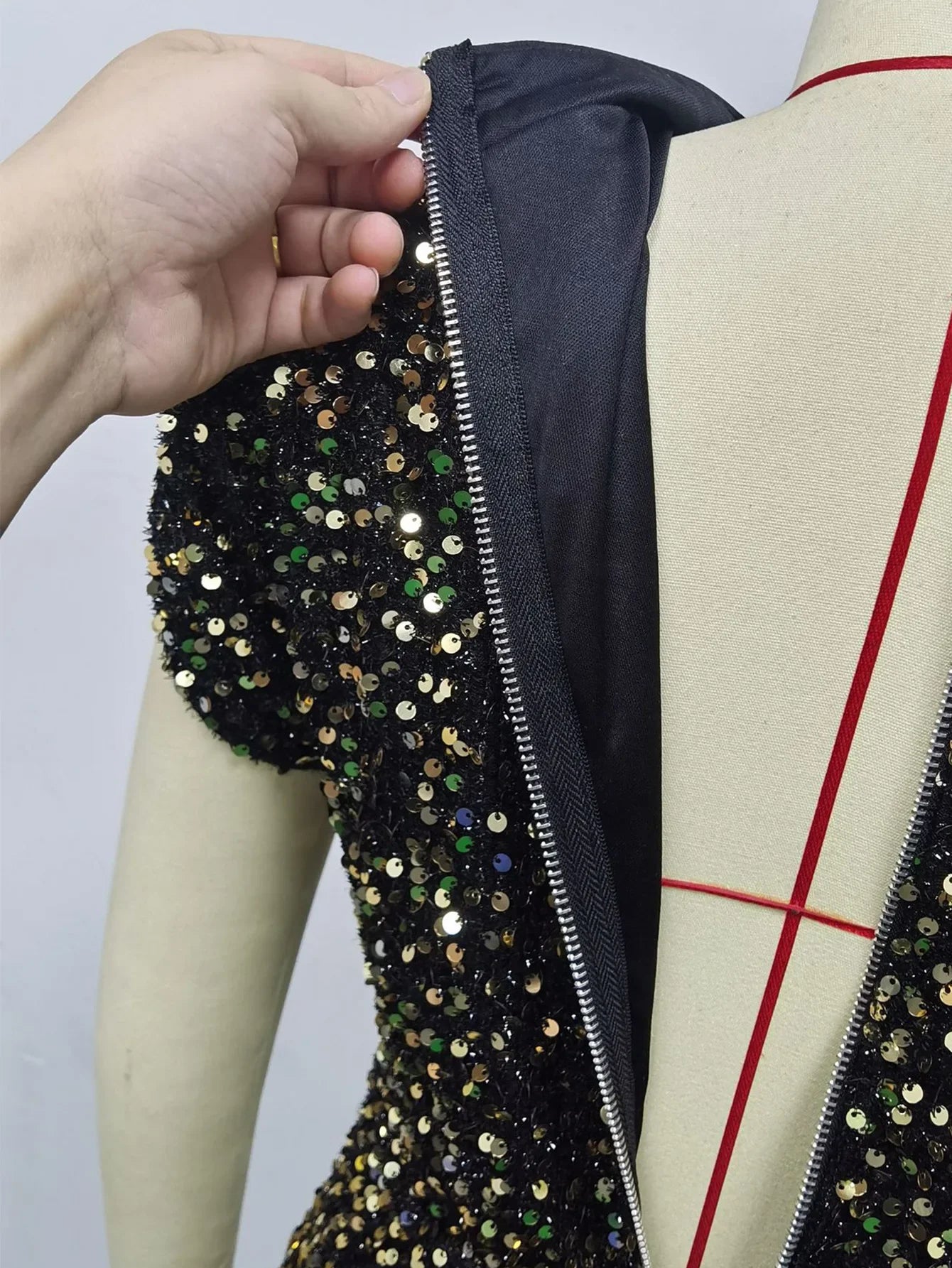 Woman wearing elegant luxury sequin midi dress with slit, sleeveless/short sleeve party and prom design