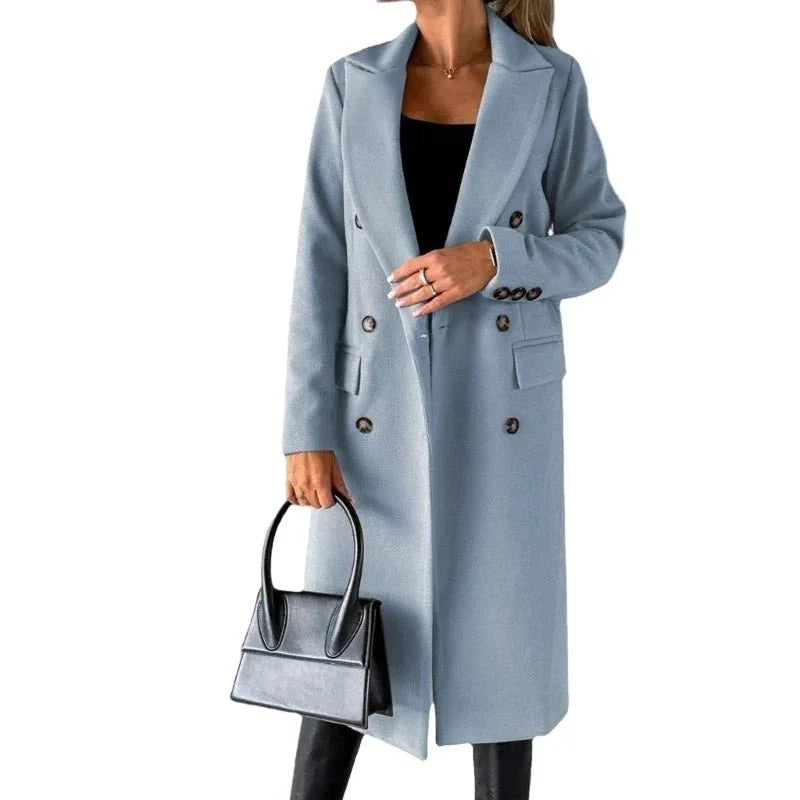 Woman wearing light blue wool trench coat with black handbag, double-breasted buttons