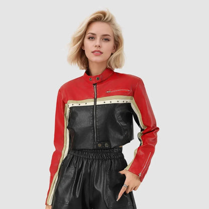 Front view of a woman wearing a red, black, and cream colorblock moto leather jacket with zipper and snap details