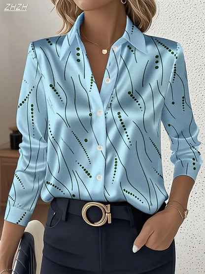 Woman wearing blue geometric striped slim blouse with black pants and gold buckle belt