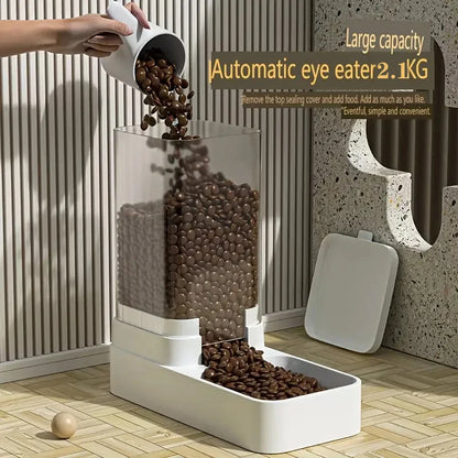 Large capacity automatic pet feeder with transparent food container pouring brown kibble into white tray