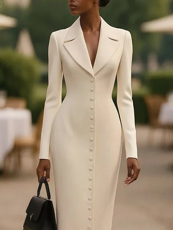 Woman wearing a tailored ivory midi dress with front buttons and lapel collar, holding a black handbag outdoors