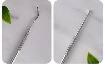 Luxury stainless steel dog dental cleaner tool with textured grip on marble surface