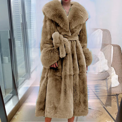 Luxury beige faux fur trench coat with wide collar and belt worn indoors near window