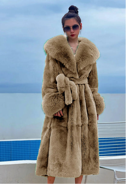 Woman wearing luxury beige faux fur trench coat with oversized collar and cuffs by the pool