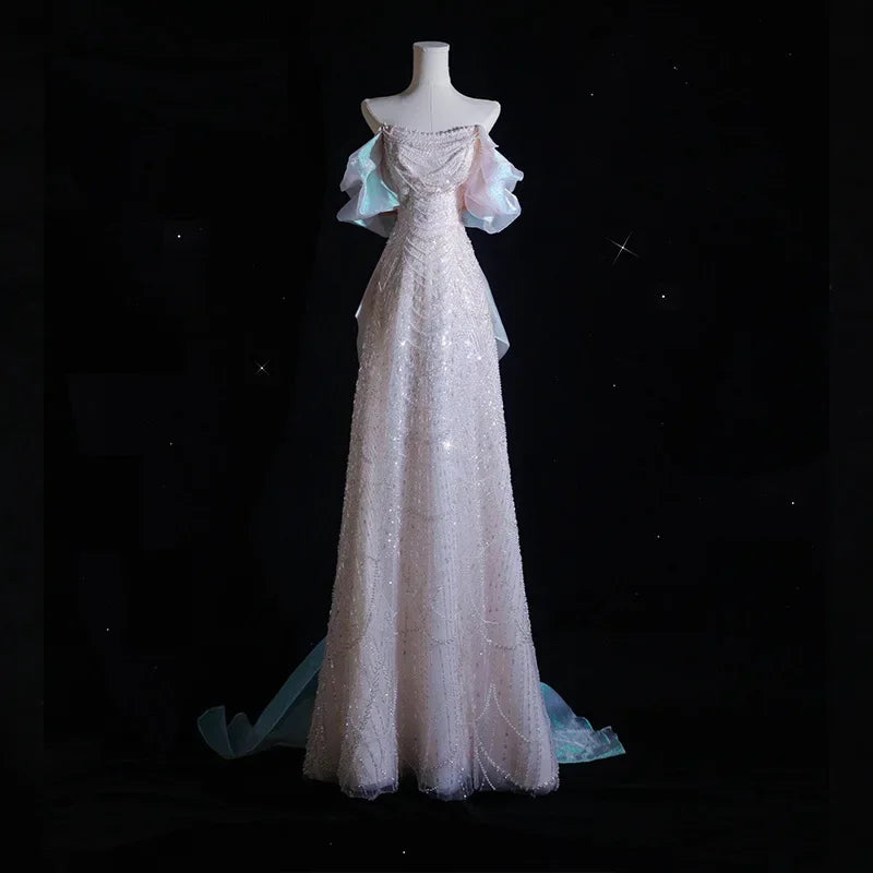 Luxury pearl and sequin evening gown with elegant bow detail, high-end formal dress for prom, parties, and special events