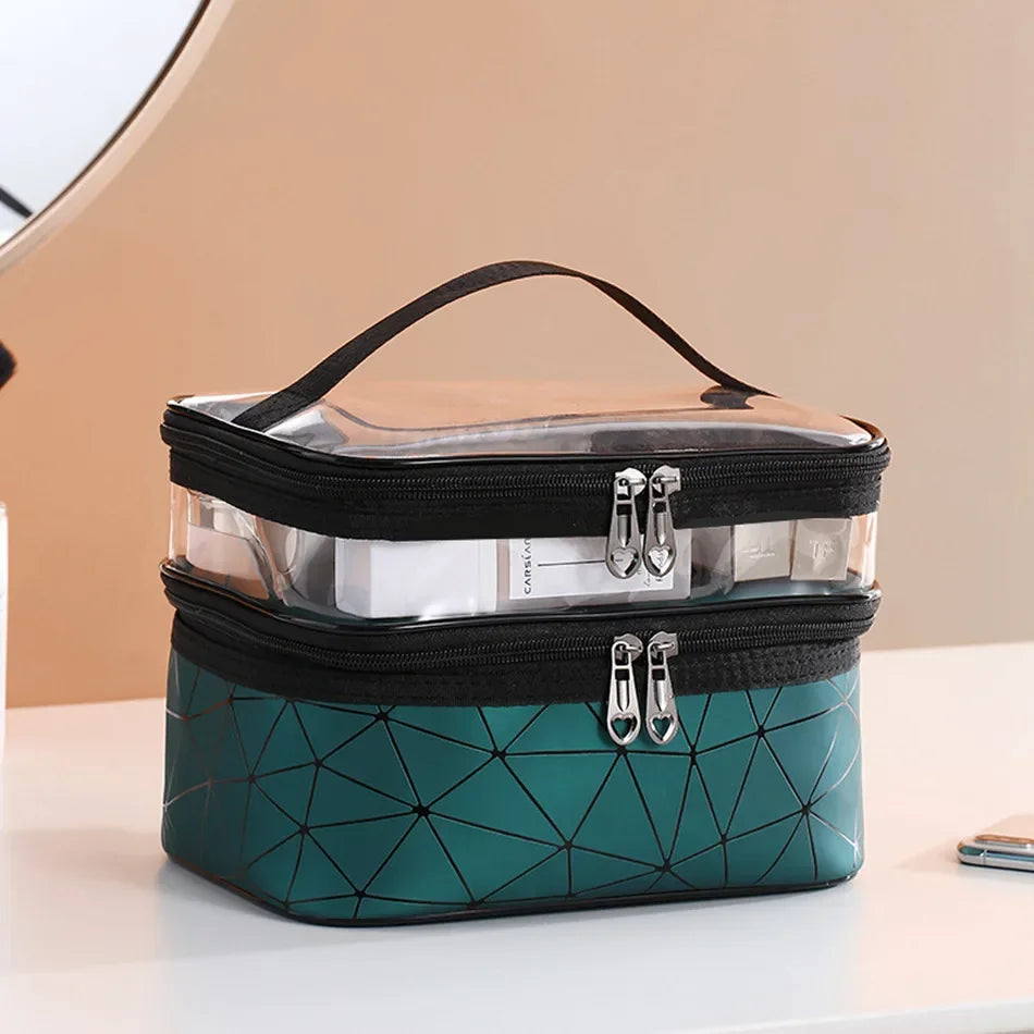 Luxury travel cosmetic organizer bag with clear top and geometric teal base on table