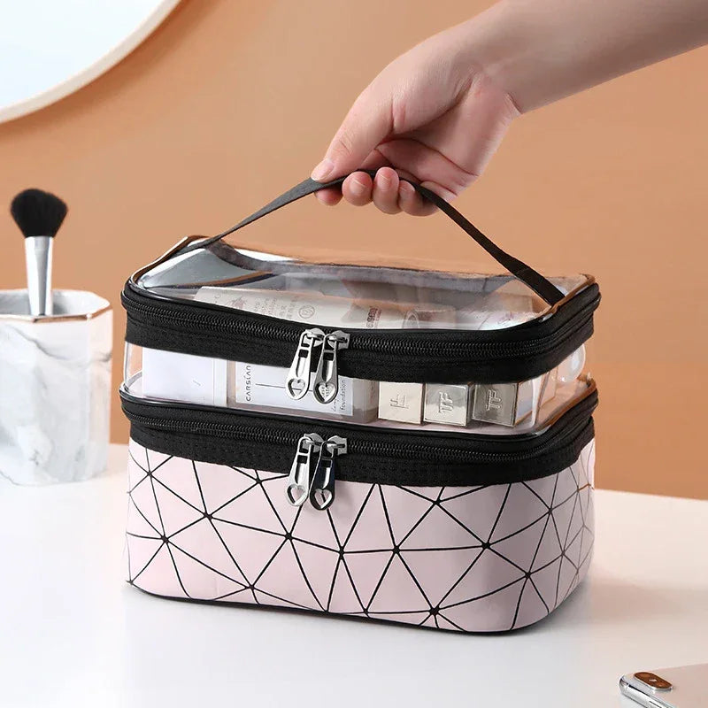 Luxury travel cosmetic organizer bag with clear top and geometric pink bottom