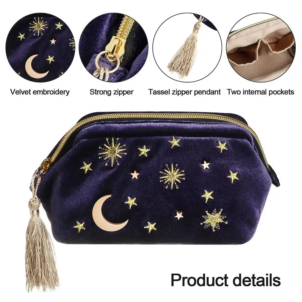 Luxury velvet embroidered cosmetic bag with gold stars, moon, and tassel zipper.