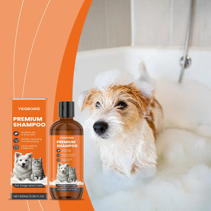 Wet dog with shampoo bubbles in bathtub next to Yegbong Premium Shampoo for dogs and cats in orange bottle