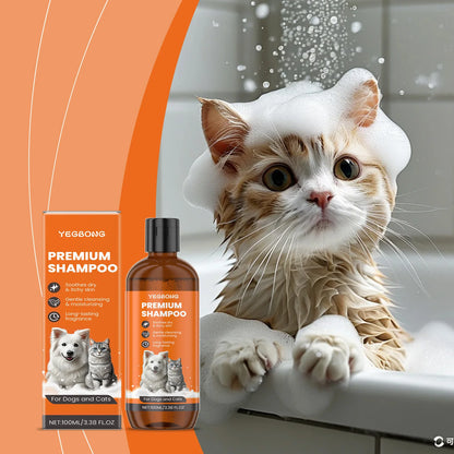 Wet cat with foam on head in bath next to orange Yegbong premium pet shampoo for dogs and cats
