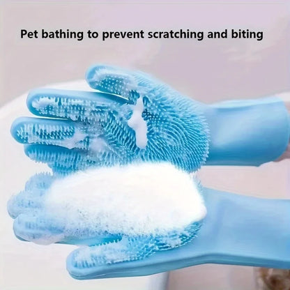 Blue silicone pet grooming gloves with soft bristles covered in soap foam for gentle pet bathing and cleaning