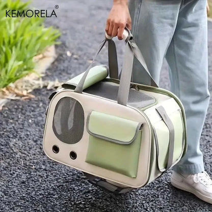Person carrying a green and beige portable pet travel carrier bag with mesh ventilation outdoors