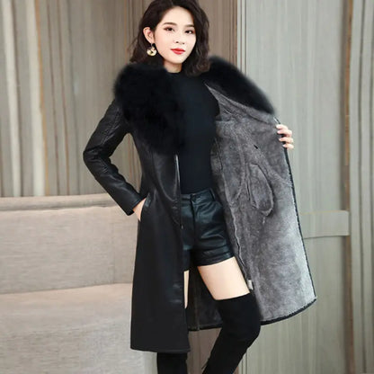 Woman modeling black PU leather coat with faux fur collar and gray inner lining