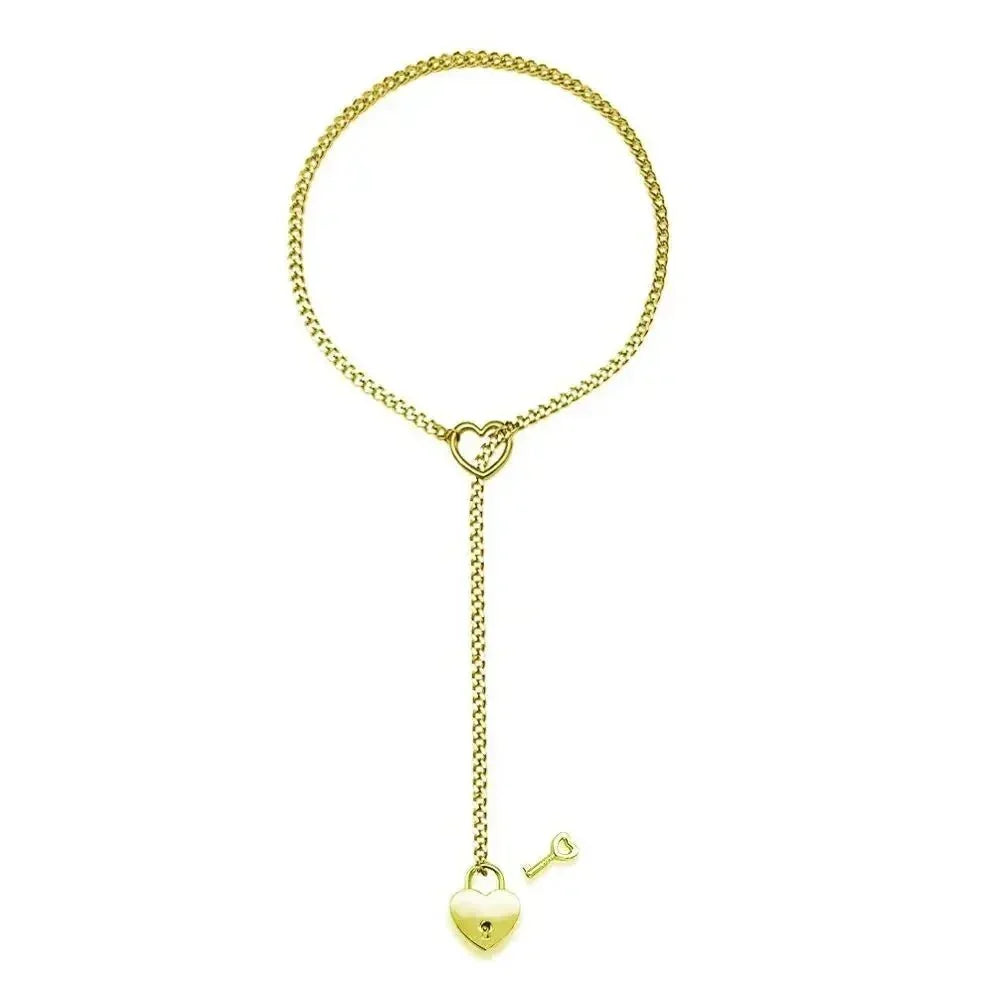 Gold Cuban chain necklace with heart lock and key pendant on white background