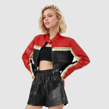 Model wearing a red, black, and cream colorblock leather moto jacket with zipper and stud details
