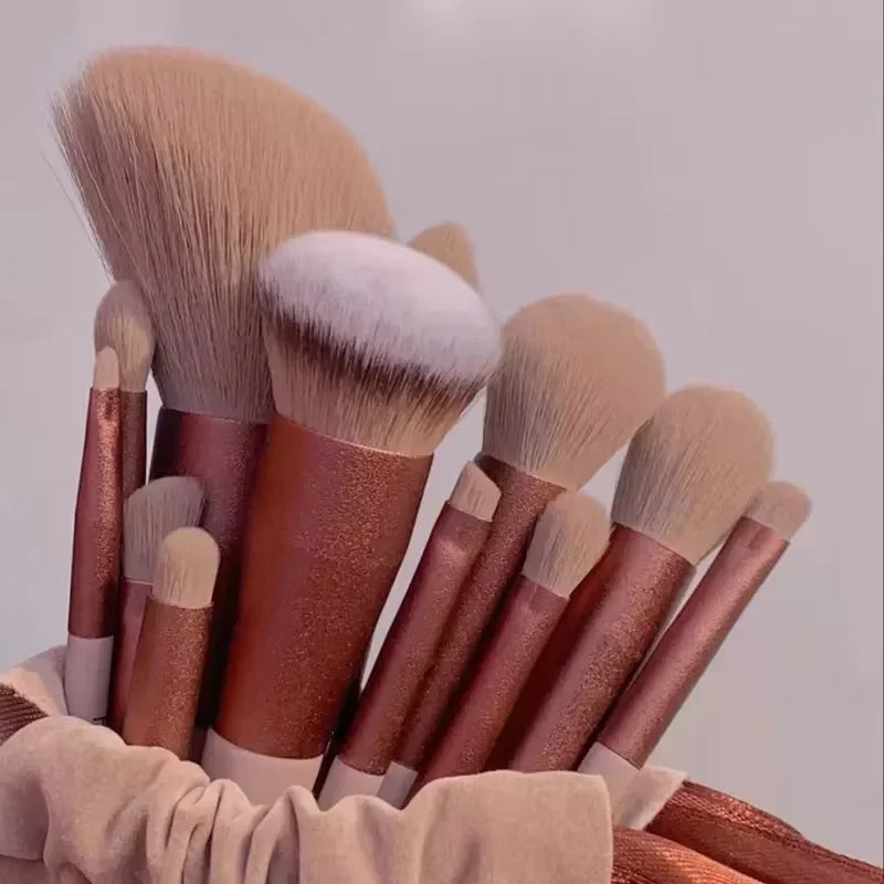 Rose gold luxury makeup brush set with soft bristles in a velvet pouch