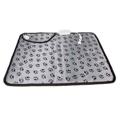 Waterproof electric pet blanket with black paw print pattern and heating control on white background