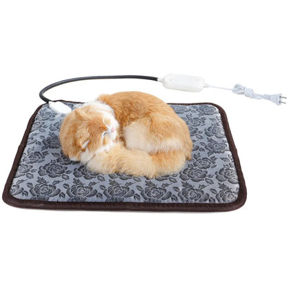 Sleeping cat on a waterproof electric heated pet blanket with floral pattern and remote control